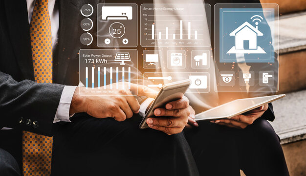 A professional couple reviews smart home energy metrics on their devices, showcasing digital graphs and solar power data in a modern, tech-savvy environment. Gantry