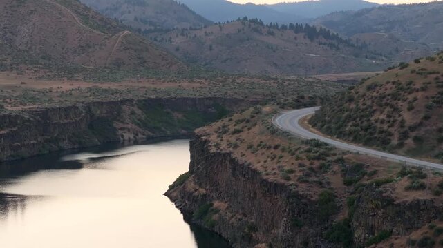 Canyon view features a river and winding road