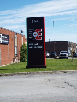 Gatineau,Quebec, Canada &ndash; May 17, 2026:A roadside pylon sign displays "164" and the "Bellai Alliance" logo, une enseigne commerciale bien visible on Rue Jean-Proulx.