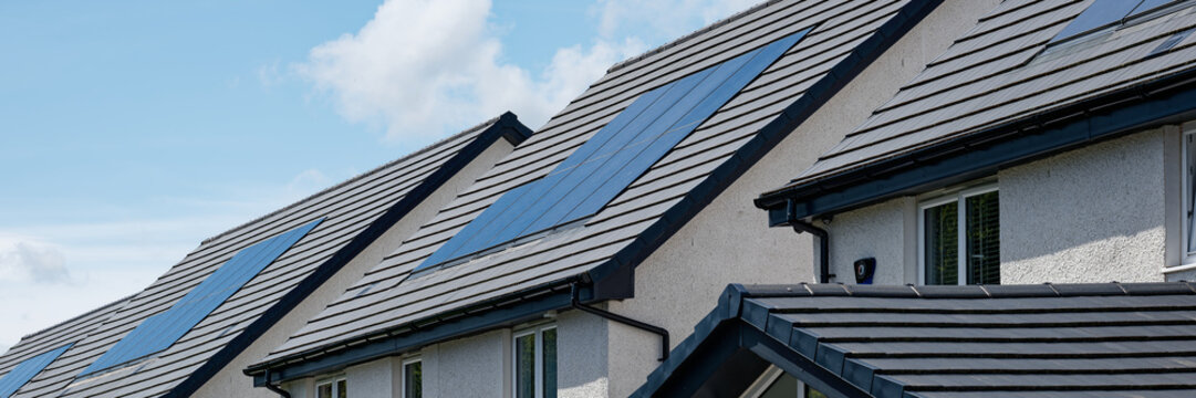 Solar panels installed on home roofs at new housing development