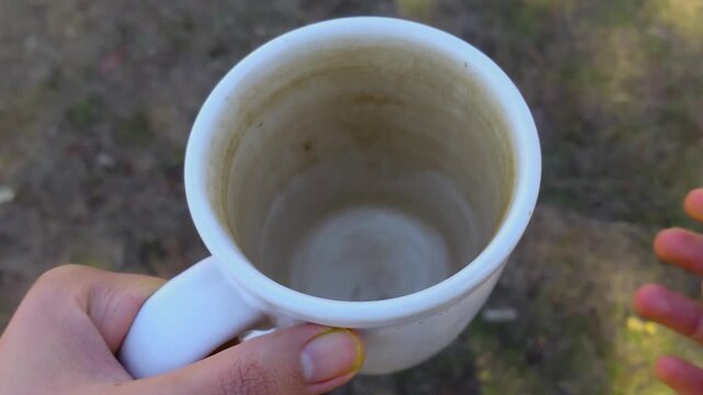 Dirty Coffee Mug with Heavy Coffee Stains or build up After Prolonged Use - Close-Up - Top View