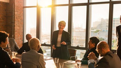 Naklejka premium Business meeting in sunlit modern office setting