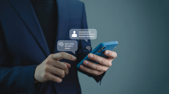 Business person sending social media messages using mobile phone with messaging, business