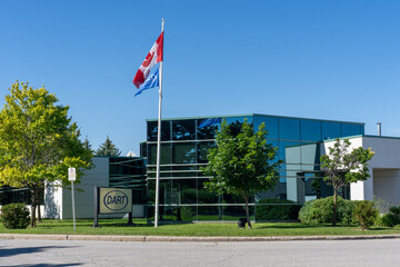 Obraz premium Toronto, Ontario, Canada - June 27, 2026: Dart Container Corporation Canadian Office and Plant on Markham Road in Toronto, Ontario, Canada. Dart Container Corporation is an American manufacturer of di