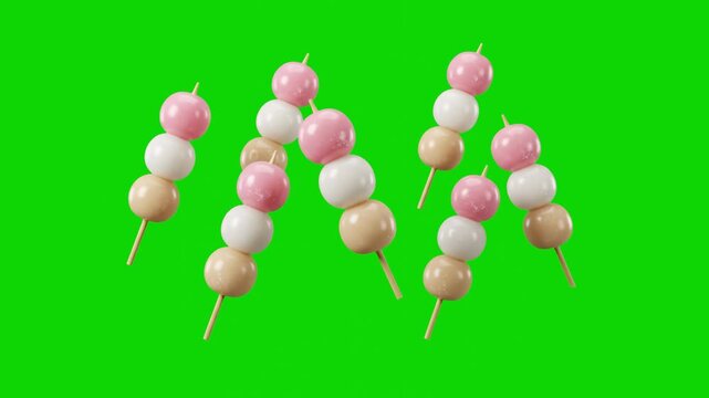 Multiple sweet Japanese dango rice dumplings on wooden skewers fall and float across a vibrant chroma key green screen. This loopable animation element is perfect for background replacement in food ad