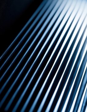 Abstract blue metallic lines with light reflections creating a sleek pattern
