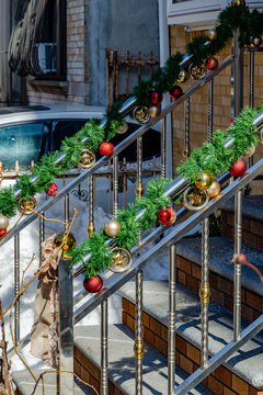 Christmas Garland and Ornaments on Brooklyn Brownstone Stoop Railing