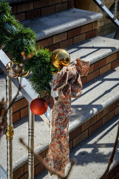 Christmas Garland and Ornaments on Brooklyn Brownstone Stoop Railing