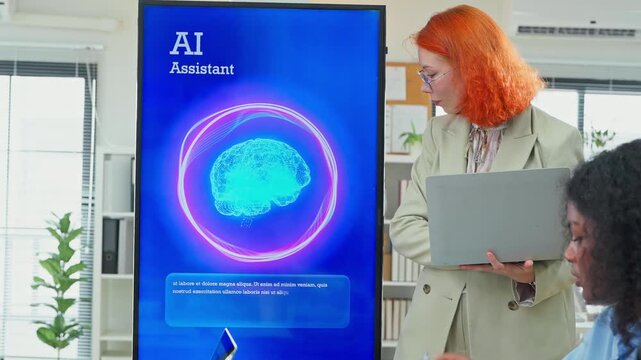 Diverse multiracial team planning new business strategy with AI marketing consultant on multiple screens and documents in modern open office, corporate restructuring and transformation concept