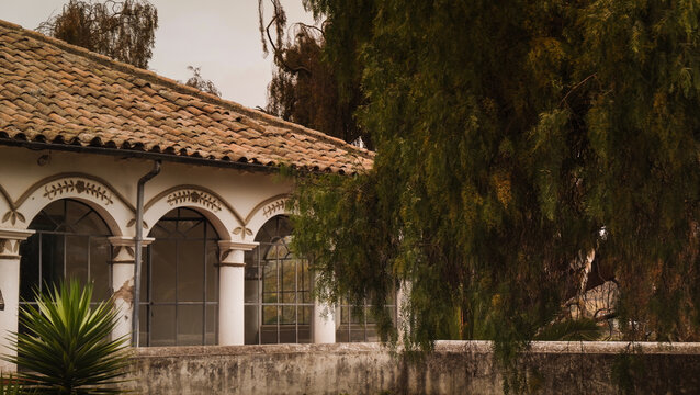 Colonial style building with arches and terracotta roof