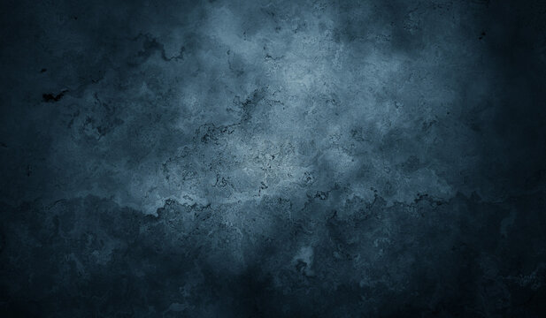Dark blue grunge concrete wall texture background with subtle mottled surface