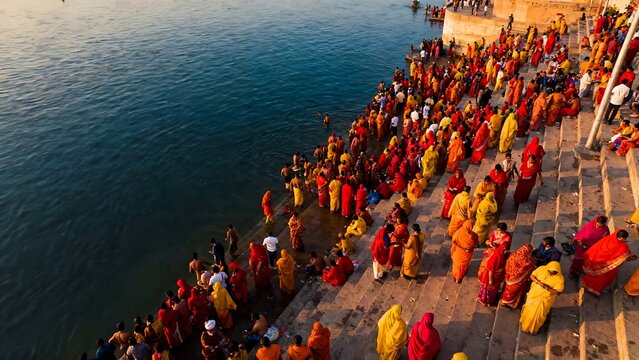 High angle view of thousands of Hindu devotees gathered at Varanasi river ghat for Chhath Puja festival