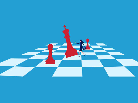 businesswoman defeated the chess king on the chessboard.