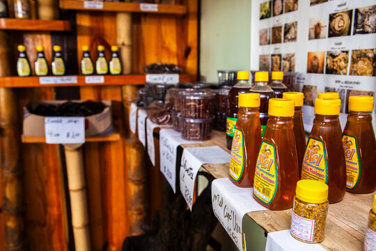 Rows of natural honey jars and propolis products displayed for sale at Apiario Flamboyant, a local bee farm featuring twenty different species of stingless bees
