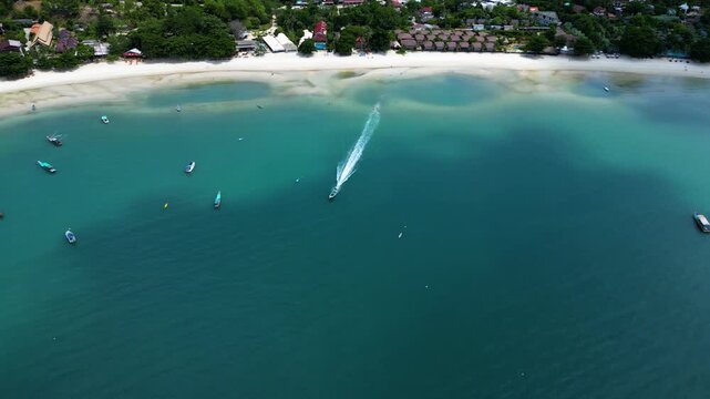 Drone View of Boat Arriving at Thong Nai Pan Beach in Koh Phangan, Thailand