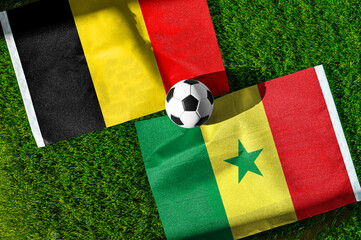 Fototapeta premium Belgium vs Senegal, national flags before international football tournament Round of 32 match, football on green grass with goal in the background, Seattle, Washington, USA, July 1, 2026
