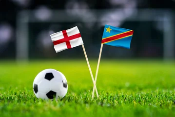 Fototapeten Restaurant England vs DR Congo, national flags before international football tournament Round of 32 match, football on green grass with goal in the background, Atlanta, Georgia, USA, July 1, 2026  © kovop58