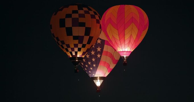 Three Dawn Patrol Hot Air Balloons Illuminate the Night Sky at 2025 Albuquerque International Balloon Fiesta