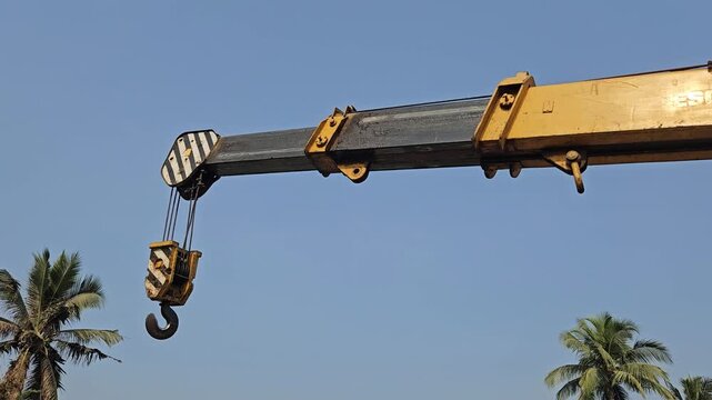 Mobile Crane Boom with Heavy Duty Lifting Hook Against Clear Blue Sky, Construction Equipment, Industrial Machinery, Engineering, Infrastructure, Crane Hook, 4K Cinematic Stock Footage