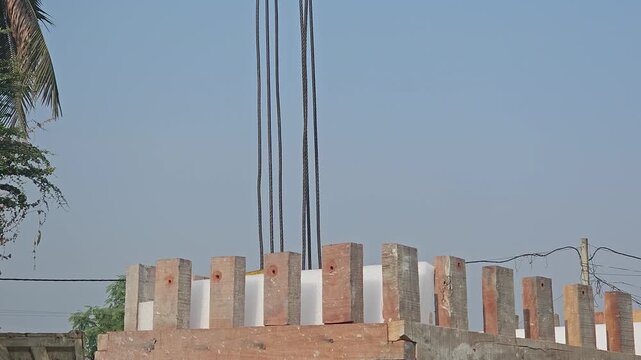 Mobile crane lifting wooden box. Heavy-duty lifting equipment, engineering, and industrial machinery under a clear blue sky. Ideal for construction companies, engineering firms, infrastructure project