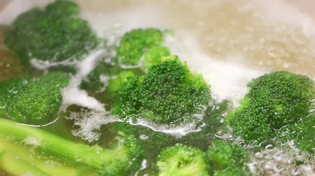 Cooking broccoli in boiling water for healthy meal
