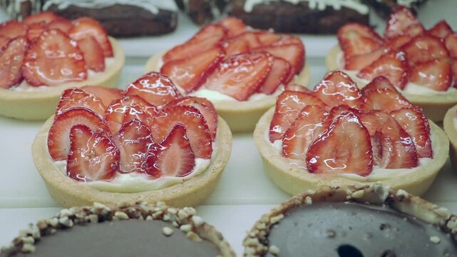 Strawberry tarts display in bakery shop window
