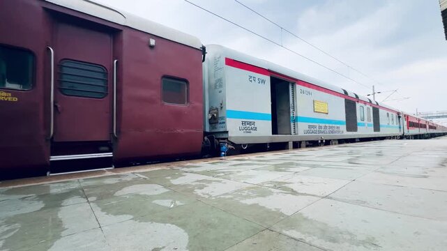 Indian railway freight coach on tracks at a station, representing cargo transport, rail logistics, and transportation infrastructure in India.