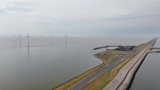 Aerial view of houtribdijk highway with offshore wind turbines