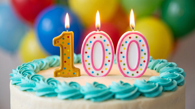 Birthday cake with 100 candles on a blurred background of colorful balloons, celebrating a centennial milestone with a festive and joyful atmosphere