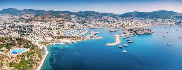 Bodrum, Turkiye, cityscape and marina in the Aegean Sea, with historic Castle and many yachts anchored © EdNurg