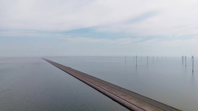 Aerial shot of houtribdijk causeway and offshore wind farm in the netherlands