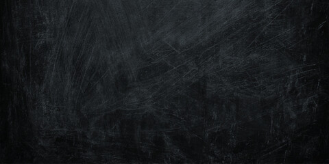 Dark scratched blackboard texture background with white chalk marks for writing or drawing © Daiyan