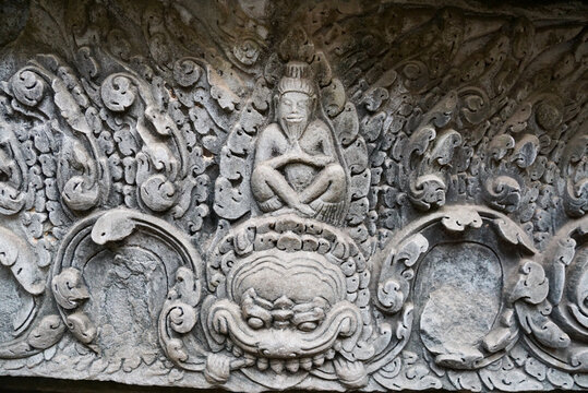 Ornate stone lintel carving at ancient Khmer temple