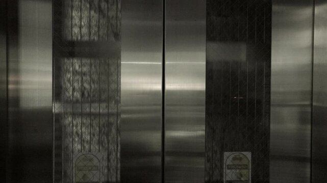 Tokyo Scene : Retro Warm Silver Elevator Descending toward the Bright World Outside | Tokyo, Japan