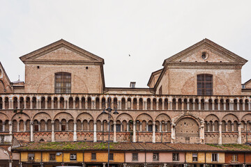 Obraz premium view of the Loggia Dei Mercanti along the south side of the San Giorgio Cathedral inside the Trento e Trieste Square, Ferrara