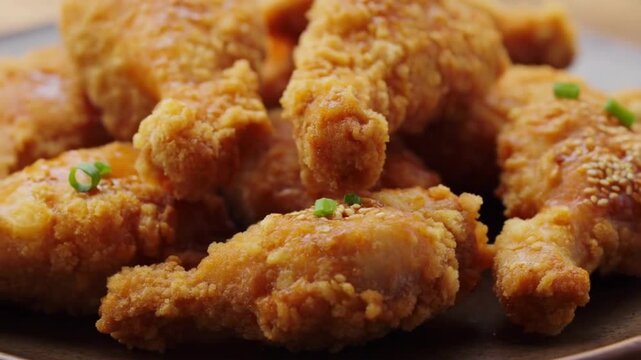 Crispy Korean fried chicken drumsticks with sesame seeds