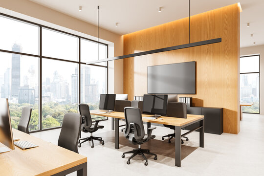 Modern open office interior with panoramic windows, wooden partitions, ergonomic desks and chairs in a bright contemporary workspace environment. 3D Rendering