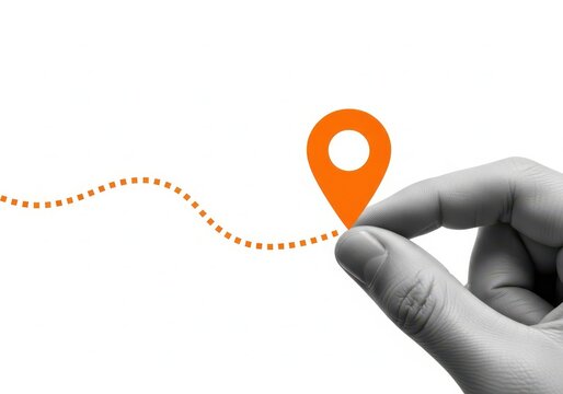 Hand holding orange location pin on dotted path isolated on white background