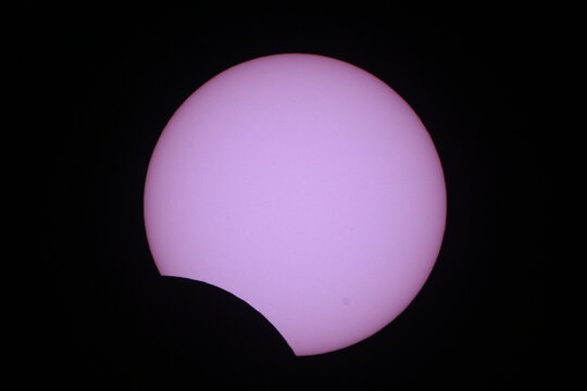 A partial solar eclipse viewed through a telescope