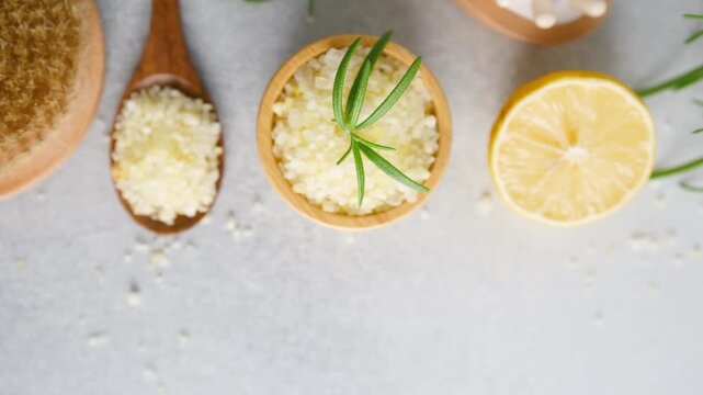 Spa salt with rosemary and lemon on a light background