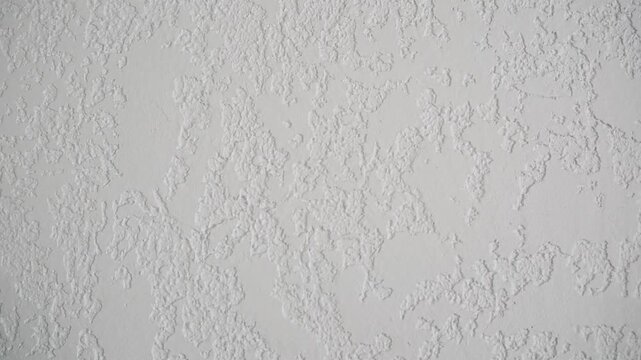 Textured white background with rough raised patterns