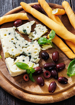 Premium blue cheese board with grissini and olives