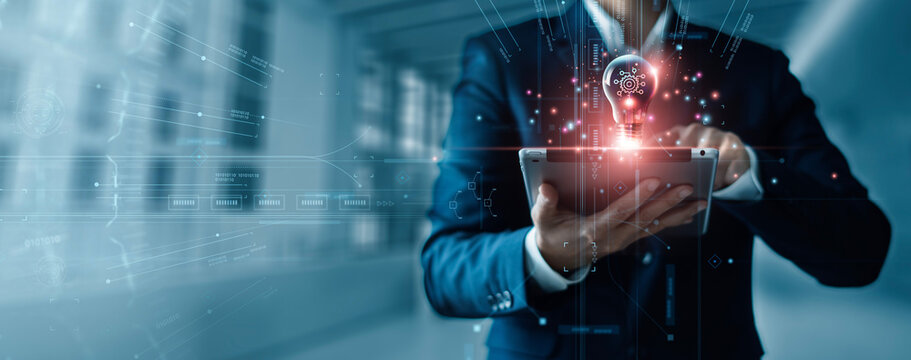 Innovation and technology business concept, Ai, Algorithm, Dynamic Business Solutions, Creativity and inspiration of business, Businessman holding tablet and light bulb with digital data network.