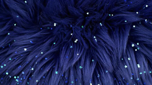Midnight blue starry fur with glittering sequins for magical celestial fashion backgrounds.