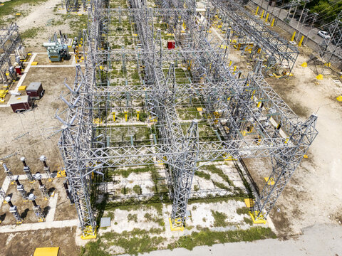 Aerial view of the CFE SE Norte electrical substation featuring complex steel structures, power transformers, and high-voltage equipment in Merida, Yucatan, Mexico.