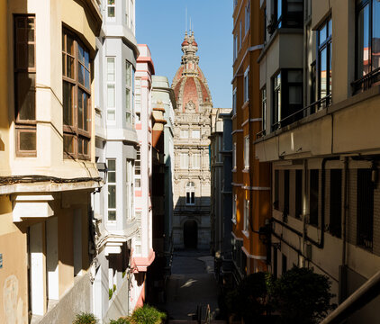 Street view with the Municipal Palace domes in La Coruna, Spain
