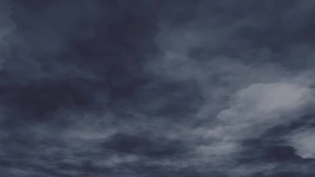 Dramatic thunderstorm with lightning flashes in dark clouds.