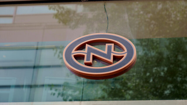Manchester, England, UK - 18 June 2026: Caffe Nero coffee shop logo sign on glass window facade, corporate brand identity of famous high street cafe chain