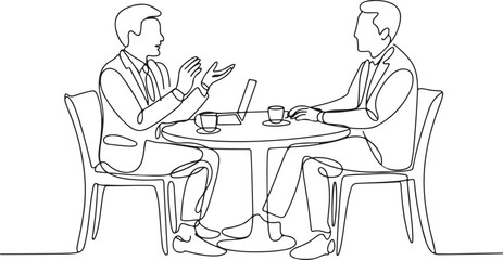 Fototapeta premium Two men in suits talking at a round table with coffee cups and laptop