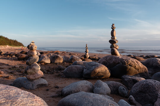 Balanced Stone Cairns on Rocky Baltic Sea Beach.